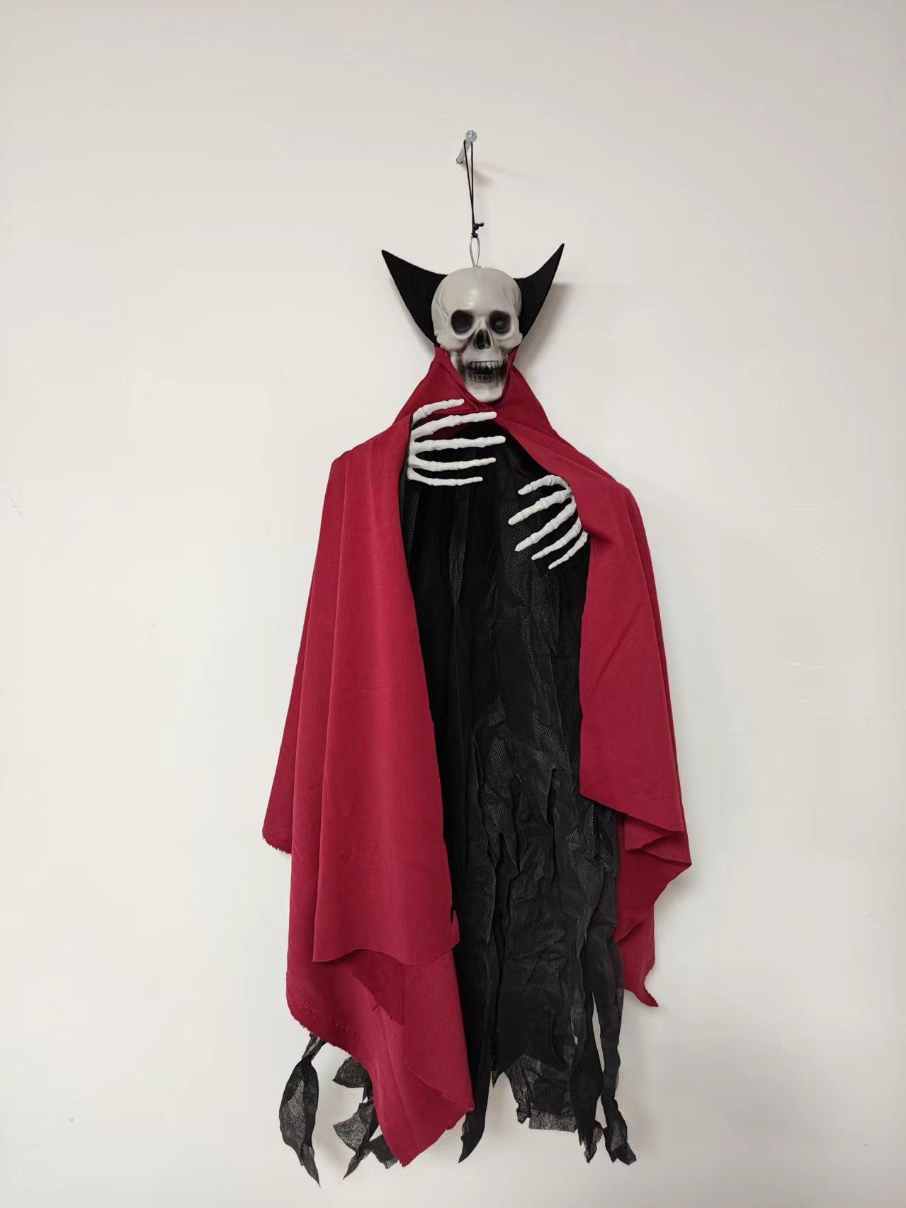 Vampiro colgante con capa roja, luz y sonido